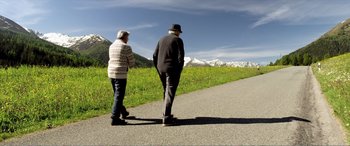 Movie still from “Youth” (2015), directed by Paolo Sorrentino – A man and a woman walking down a road; Wide shot, Low angle