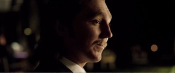 Movie still from “Youth” (2015), directed by Paolo Sorrentino – A person wearing a suit and tie; Close Up shot, Low angle