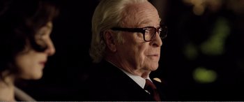 Movie still from “Youth” (2015), directed by Paolo Sorrentino – An older man wearing glasses and a suit; Close Up shot, Low angle