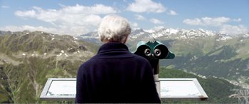 Movie still from “Youth” (2015), directed by Paolo Sorrentino – An older man looking out at a mountain range; Medium shot, Over the shoulder angle