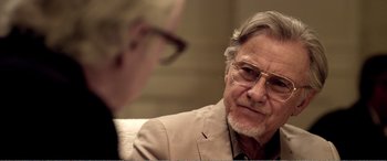 Movie still from “Youth” (2015), directed by Paolo Sorrentino – An older man wearing glasses and a suit; Close Up shot, Over the shoulder angle