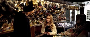 Movie still from “Youth” (2015), directed by Paolo Sorrentino – A young girl talking to an adult in a store; Medium shot, Over the shoulder angle