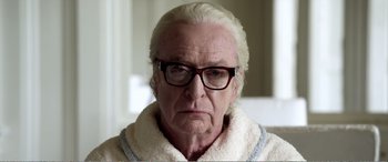 Movie still from “Youth” (2015), directed by Paolo Sorrentino – An older man with glasses and a white hair; Close Up shot, Over the shoulder angle