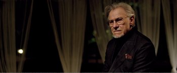 Movie still from “Youth” (2015), directed by Paolo Sorrentino – An older man wearing glasses and a black jacket; Close Up shot, Over the shoulder angle