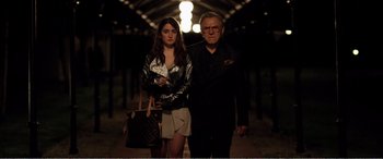 Movie still from “Youth” (2015), directed by Paolo Sorrentino – A man and a woman standing next to each other; Medium shot, Low angle