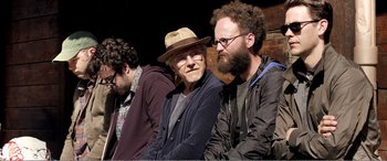 Movie still from “Youth” (2015), directed by Paolo Sorrentino – A group of men sitting next to each other; Medium shot, Over the shoulder angle