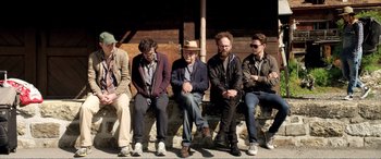 Movie still from “Youth” (2015), directed by Paolo Sorrentino – A group of men sitting on a bench; Wide shot, High angle