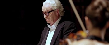 Movie still from “Youth” (2015), directed by Paolo Sorrentino – An older man wearing a suit and bow tie; Close Up shot, Low angle