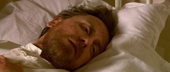 Movie still from “Youth Without Youth” (2007), directed by Francis Ford Coppola – A person laying in a bed; Close Up shot, Overhead angle