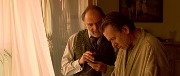 Movie still from “Youth Without Youth” (2007), directed by Francis Ford Coppola – Two men are looking at each other in a room; Medium shot, Over the shoulder angle