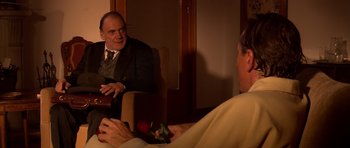 Movie still from “Youth Without Youth” (2007), directed by Francis Ford Coppola – A man sitting in front of a mirror talking to another man; Medium shot, Over the shoulder angle