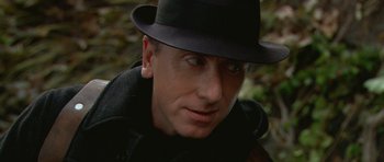Movie still from “Youth Without Youth” (2007), directed by Francis Ford Coppola – A person wearing a hat; Close Up shot, Over the shoulder angle
