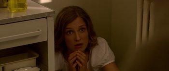 Movie still from “Youth Without Youth” (2007), directed by Francis Ford Coppola – A beautiful woman leaning against a wall with her head on her hands; Close Up shot, High angle