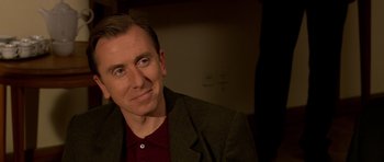 Movie still from “Youth Without Youth” (2007), directed by Francis Ford Coppola – A person wearing a jacket; Close Up shot, Over the shoulder angle