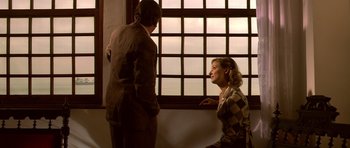 Movie still from “Youth Without Youth” (2007), directed by Francis Ford Coppola – A man and a woman are standing in front of a window; Medium shot, Over the shoulder angle