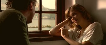 Movie still from “Youth Without Youth” (2007), directed by Francis Ford Coppola – A man and a woman sitting in front of a window; Close Up shot, Over the shoulder angle