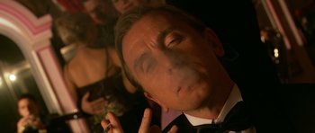 Movie still from “Youth Without Youth” (2007), directed by Francis Ford Coppola – A person smoking a cigarette; Close Up shot, Low angle