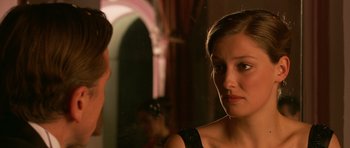 Movie still from “Youth Without Youth” (2007), directed by Francis Ford Coppola – A woman in a black dress looking at a man in a black suit; Close Up shot, Over the shoulder angle