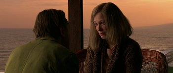 Movie still from “Youth Without Youth” (2007), directed by Francis Ford Coppola – A woman sitting next to a man in front of the ocean; Close Up shot, Over the shoulder angle