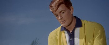Movie still from “Zabriskie Point” (1970), directed by Michelangelo Antonioni – A wax figure of david bowie is shown in a yellow jacket; Close Up shot, Low angle