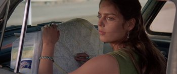 Movie still from “Zabriskie Point” (1970), directed by Michelangelo Antonioni – A woman holding a map in her hand; Close Up shot, High angle