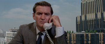 Movie still from “Zabriskie Point” (1970), directed by Michelangelo Antonioni – A man talking on a phone; Close Up shot, Low angle