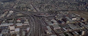 Movie still from “Zabriskie Point” (1970), directed by Michelangelo Antonioni – An aerial view of an intersection in a large city; Extreme Wide shot, High angle