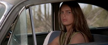 Movie still from “Zabriskie Point” (1970), directed by Michelangelo Antonioni – A woman sitting in the back seat of a car looking out the window; Close Up shot, Low angle