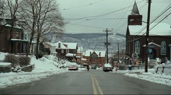 Movie still from “Zack and Miri Make a Porno” (2008), directed by Kevin Smith – Cars driving down a street in the snow; Extreme Wide shot, High angle