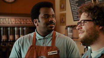 Movie still from “Zack and Miri Make a Porno” (2008), directed by Kevin Smith – A man in an apron is talking to another man in an apron; Close Up shot, Over the shoulder angle
