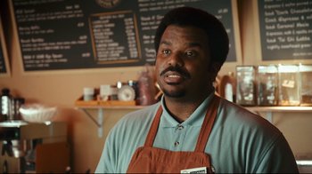 Movie still from “Zack and Miri Make a Porno” (2008), directed by Kevin Smith – A man wearing an apron standing in front of a chalkboard; Medium shot, Over the shoulder angle