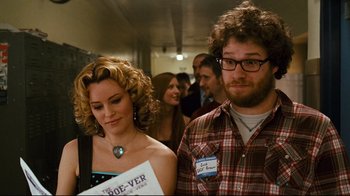 Movie still from “Zack and Miri Make a Porno” (2008), directed by Kevin Smith – A man and a woman standing next to each other; Medium shot, Over the shoulder angle