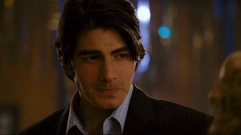 Movie still from “Zack and Miri Make a Porno” (2008), directed by Kevin Smith – A person wearing a suit and tie; Close Up shot, Over the shoulder angle