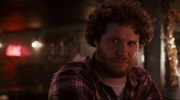 Movie still from “Zack and Miri Make a Porno” (2008), directed by Kevin Smith – A person wearing a plaid shirt; Close Up shot, Low angle