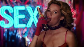 Movie still from “Zack and Miri Make a Porno” (2008), directed by Kevin Smith – A beautiful woman holding a bottle of champagne; Close Up shot, Low angle