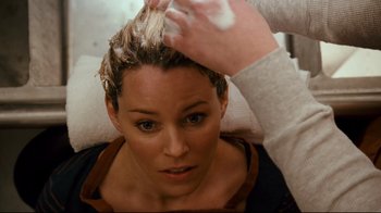 Movie still from “Zack and Miri Make a Porno” (2008), directed by Kevin Smith – A woman getting her hair brushed by a stylist; Close Up shot, Over the shoulder angle