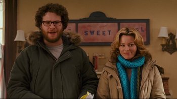 Movie still from “Zack and Miri Make a Porno” (2008), directed by Kevin Smith – A man and a woman standing next to each other; Medium shot, Over the shoulder angle