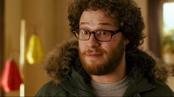 Movie still from “Zack and Miri Make a Porno” (2008), directed by Kevin Smith – A person wearing glasses and a jacket; Close Up shot, Over the shoulder angle