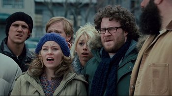 Movie still from “Zack and Miri Make a Porno” (2008), directed by Kevin Smith – A group of people standing next to each other on a street; Medium shot, Low angle