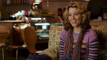 Movie still from “Zack and Miri Make a Porno” (2008), directed by Kevin Smith – A woman sitting in a chair in a restaurant; Medium shot, Over the shoulder angle