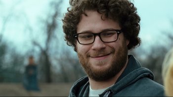 Movie still from “Zack and Miri Make a Porno” (2008), directed by Kevin Smith – A person wearing glasses and a beard; Close Up shot, Over the shoulder angle