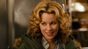 Movie still from “Zack and Miri Make a Porno” (2008), directed by Kevin Smith – A person with curly blonde hair; Close Up shot, Over the shoulder angle