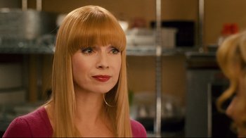 Movie still from “Zack and Miri Make a Porno” (2008), directed by Kevin Smith – A woman with long blonde hair wearing a pink shirt; Close Up shot, Over the shoulder angle