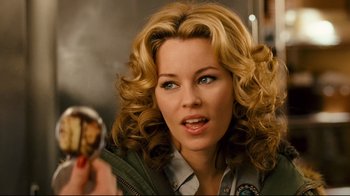 Movie still from “Zack and Miri Make a Porno” (2008), directed by Kevin Smith – A person holding food in their hand; Close Up shot, Overhead angle