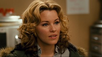 Movie still from “Zack and Miri Make a Porno” (2008), directed by Kevin Smith – A person with curly hair; Close Up shot, Over the shoulder angle