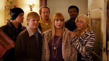 Movie still from “Zack and Miri Make a Porno” (2008), directed by Kevin Smith – A group of people standing next to each other in front of a wall; Medium shot, High angle