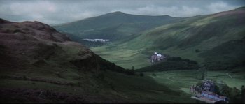 Movie still from “Zardoz” (1974), directed by John Boorman – A view of a valley with a mountain in the background; Extreme Wide shot, High angle