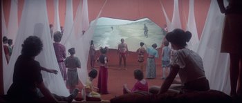 Movie still from “Zardoz” (1974), directed by John Boorman – A group of people standing around a beach; Extreme Wide shot, High angle