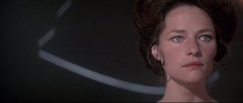 Movie still from “Zardoz” (1974), directed by John Boorman – A person wearing a pair of earrings; Close Up shot, Low angle