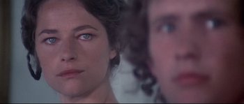 Movie still from “Zardoz” (1974), directed by John Boorman – A woman and a man's face; Close Up shot, Over the shoulder angle